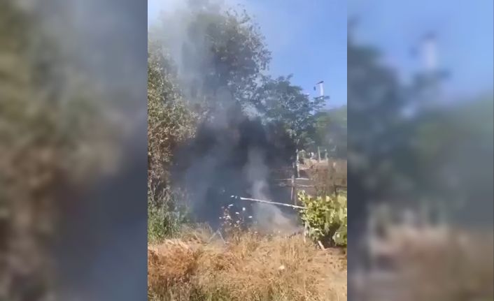 Kırık cam şişeleri otluk alanı tutuşturdu