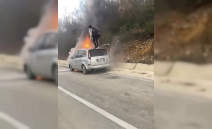 Otomobil alev topuna döndü, canını hiçe sayıp yangını söndürmeye çalıştı