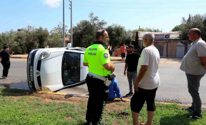 Yan yatıp sürüklenen araçtan yara almadan çıktılar