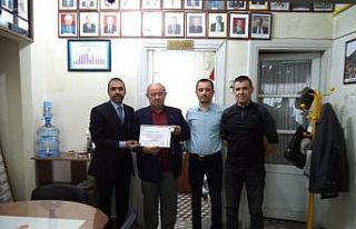 Şakar’a onur belgesi