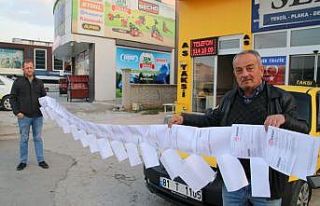 Yediği trafik cezaları 6 metreyi buldu