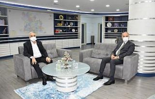 Eski Bakan’dan Başkan Özlü’ye ziyaret