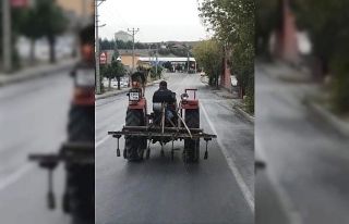Köpeğini traktöre bindiren çiftçi gönülleri...