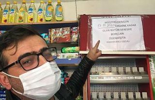 (Özel) İki hayırsever bakkal defterini satın aldı