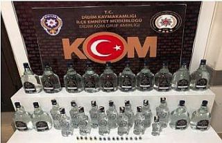 Didim’de sahte içki ve kaçak cep telefonu operasyonu