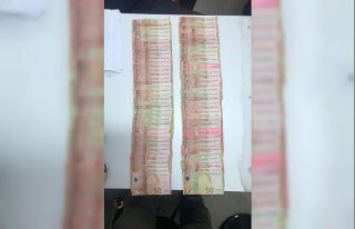 Sahte paralar ile cep telefonu almak istediler: Üzerlerinden...