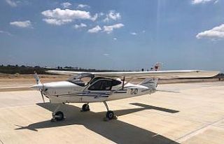 Eğitim uçağı, inşaatı süren Çukurova Havalimanına...