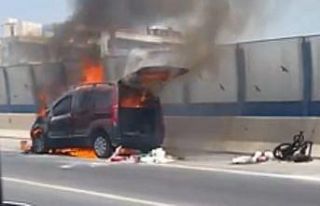 Bir anda alev alan aracını söndürmek isterken...