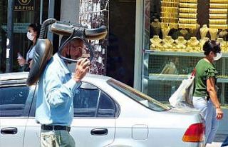 Sıcaktan korunmak isteyen vatandaştan ilginç yöntem:...