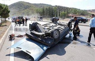 Takla atan otomobilden burnu bile kanamadan kurtuldu