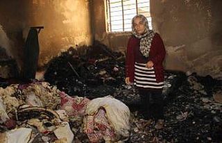 Evini ateşe veren adamı komşuları kurtardı