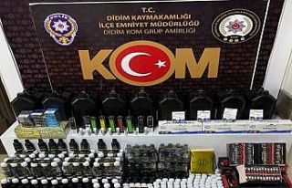 Didim’de kaçak içki ve sigara ele geçirildi