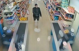 Yüzüne kadın çorabı geçirdi, marketin kasasını...