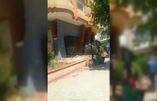 Ağır hasarlı binanın su kuyusunda bir şahıs...