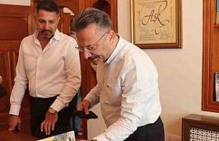 Eskişehir Valisi Hüseyin Aksoy ve eşi Hülya Aksoy,...