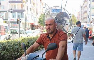 Sıcaktan bunalan vatandaş motosiklete vantilatör...